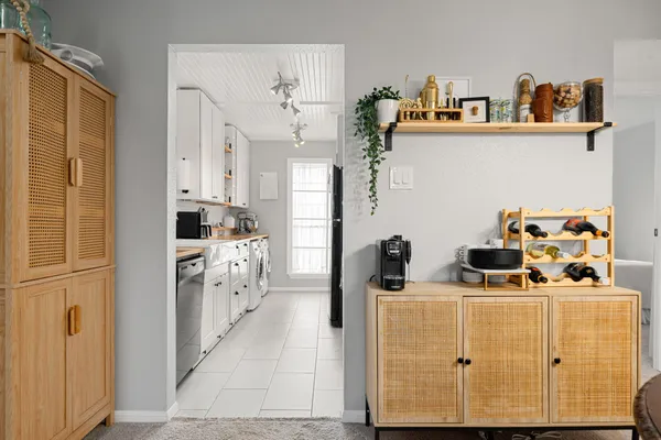 a kitchen with cabinets and refrigerator