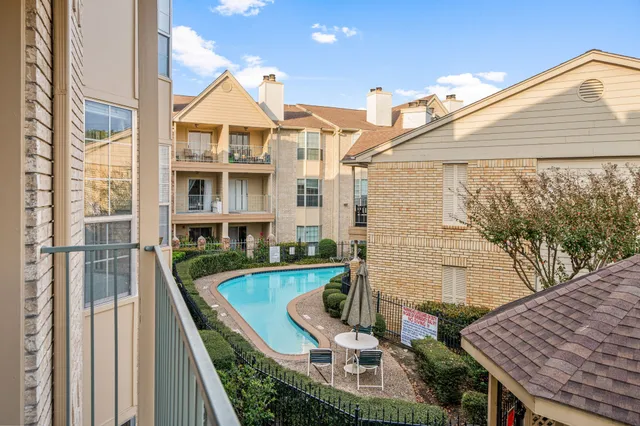 a view of balcony with furniture