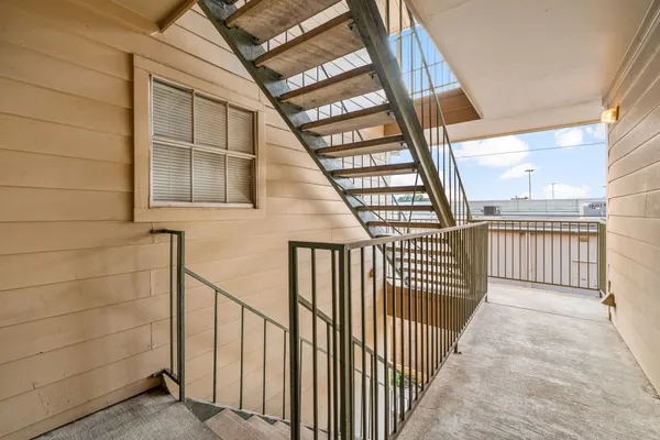 a view of staircase with large window