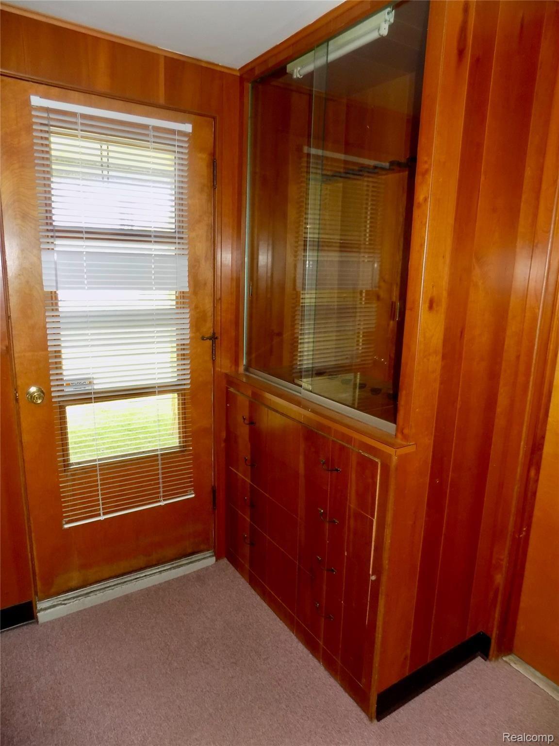 1348 Butcher Road Fenton, MI 48430 - Photo 22 of 28 BUILT IN CABINET AT REAR DOOR