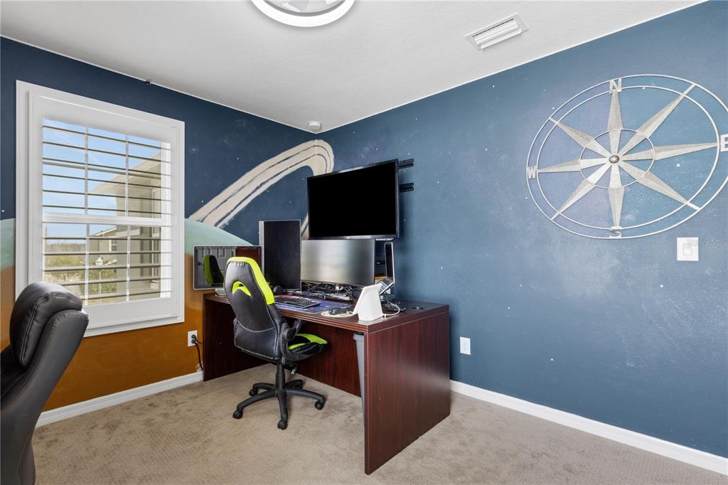 19613 Long Lake Ranch Boulevard Lutz, FL 33558 - Photo 22 of 59 a view of a workspace with furniture and a window