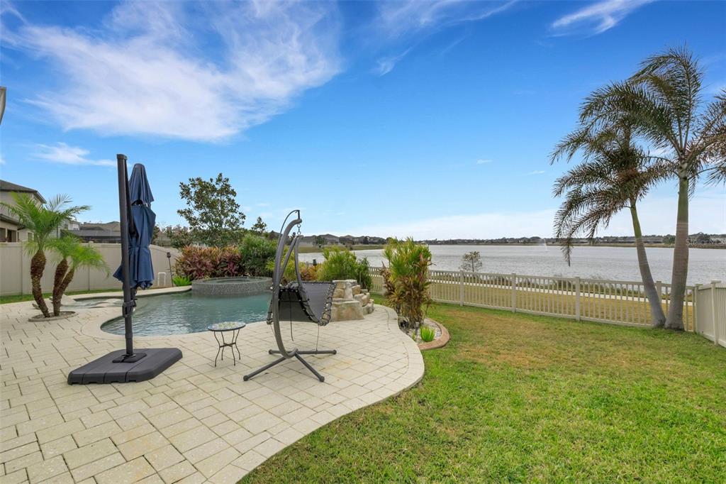 19613 Long Lake Ranch Boulevard Lutz, FL 33558 - Photo 33 of 59 a view of a swimming pool with a patio and ocean view