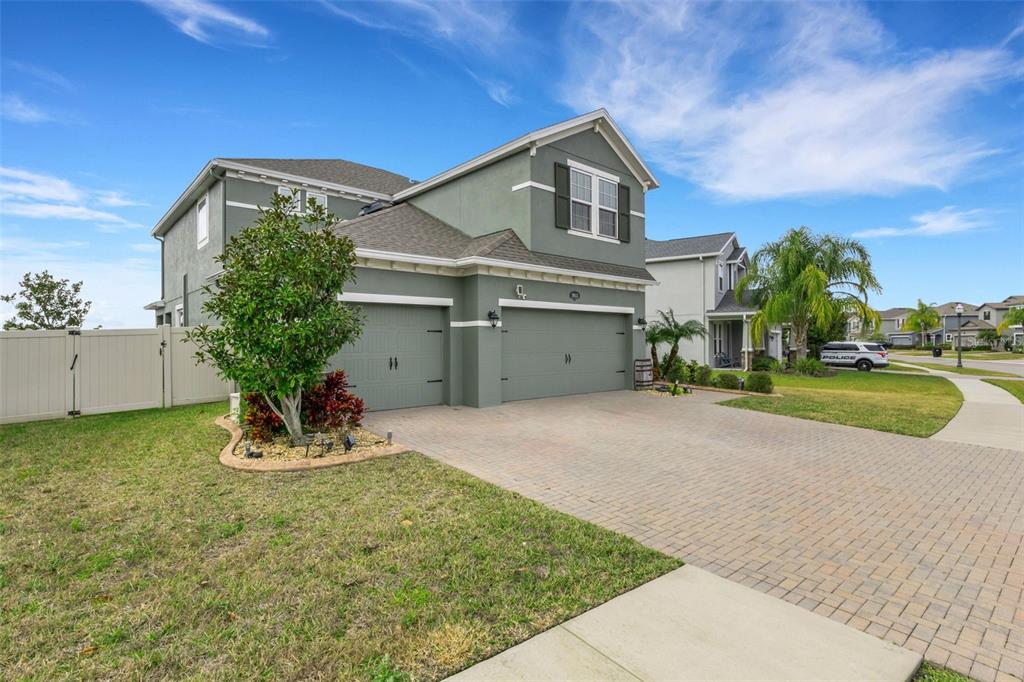 19613 Long Lake Ranch Boulevard Lutz, FL 33558 - Photo 36 of 59 a front view of a house with garden