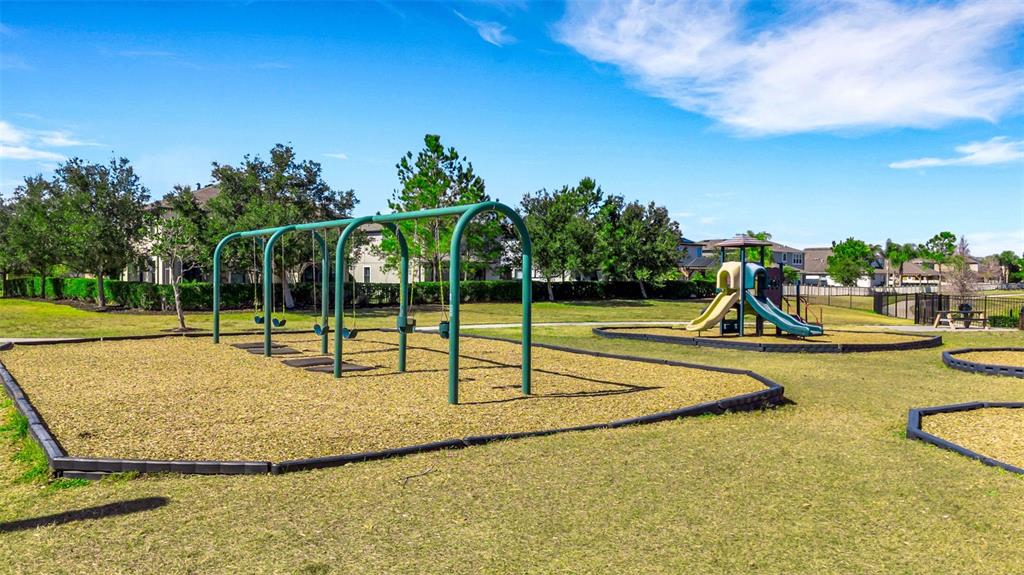19613 Long Lake Ranch Boulevard Lutz, FL 33558 - Photo 57 of 59 a view of a swimming pool with an outdoor space and seating area