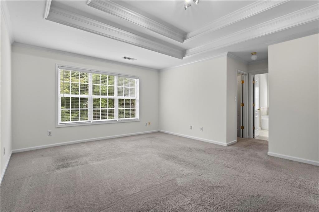 4282 Goldfield Trace, Unit MAIN & 2 Suwanee, GA 30024 - Photo 15 of 28 an empty room with windows