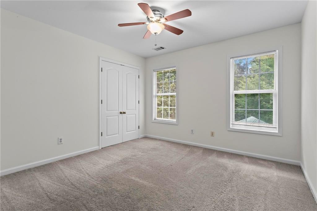4282 Goldfield Trace, Unit MAIN & 2 Suwanee, GA 30024 - Photo 20 of 28 a view of an empty room with a window