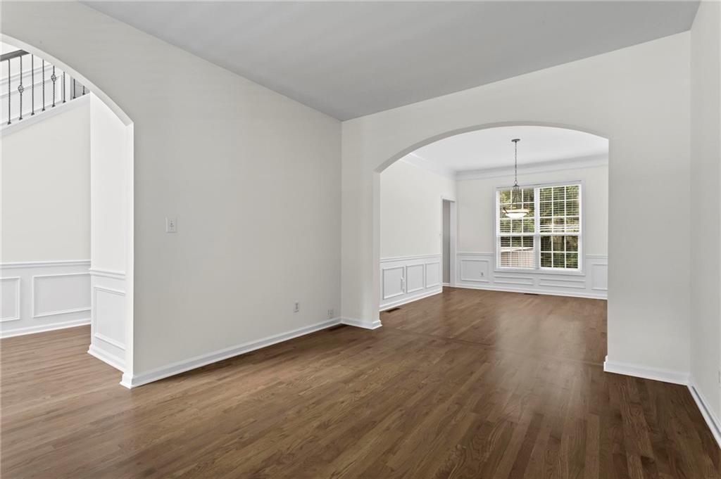 4282 Goldfield Trace, Unit MAIN & 2 Suwanee, GA 30024 - Photo 5 of 28 an empty room with wooden floor and windows