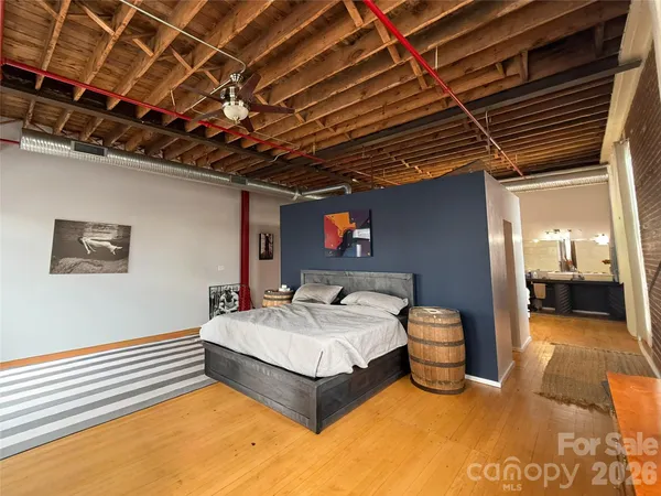 a bedroom with a bed and a walk in closet