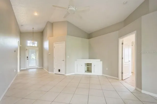 a view of empty room with closet and entryway