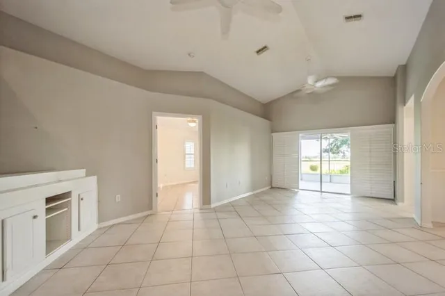 a view of a kitchen with an entryway and a fireplace