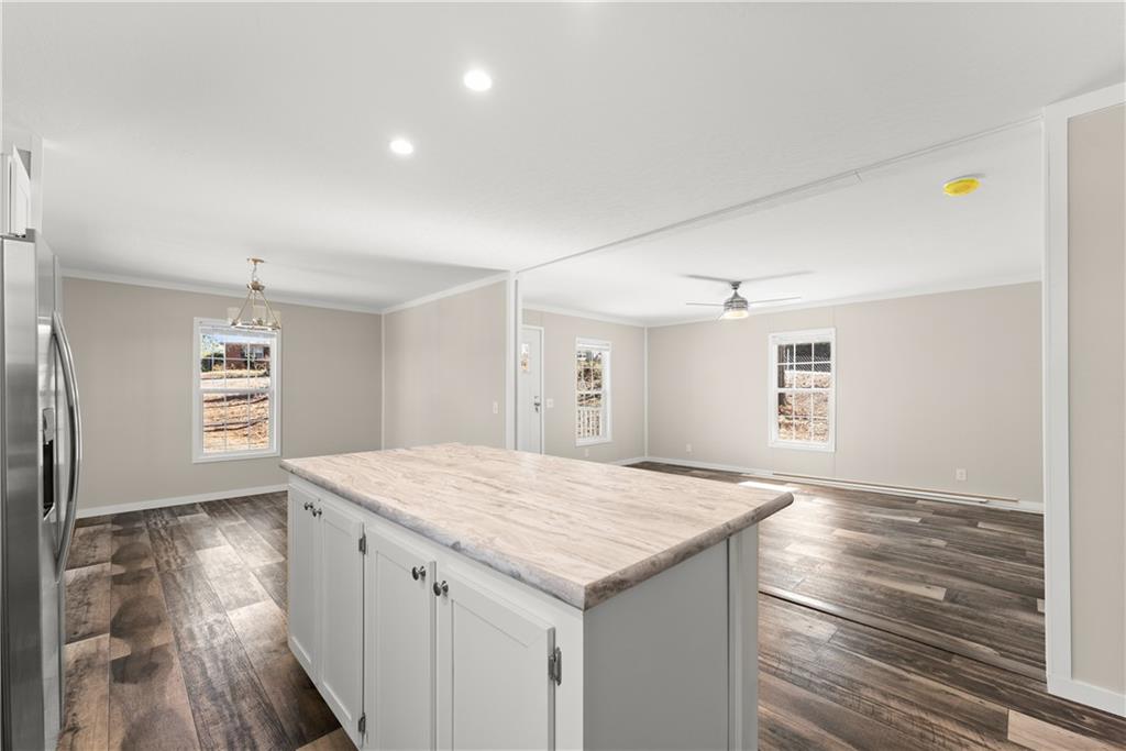 2410 Bolman Road Gainesville, GA 30507 - Photo 11 of 32 an empty room with windows and entrance