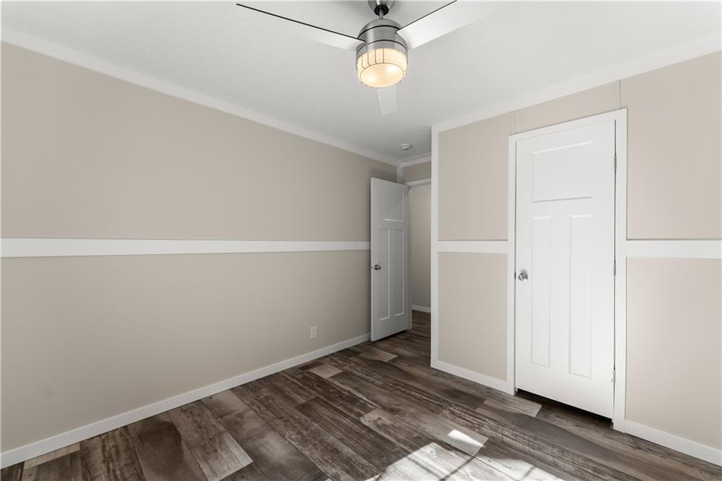 2410 Bolman Road Gainesville, GA 30507 - Photo 14 of 32 a view of an empty room with wooden floor