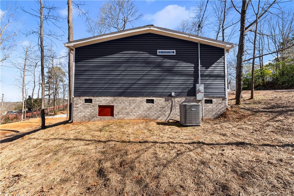 2410 Bolman Road Gainesville, GA 30507 - Photo 24 of 32 a view of wooden house with a small yard