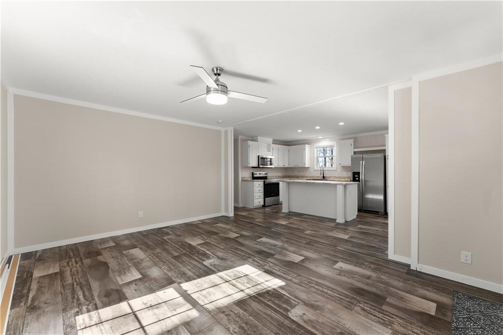 2410 Bolman Road Gainesville, GA 30507 - Photo 4 of 32 a view of a kitchen with wooden floor and a kitchen