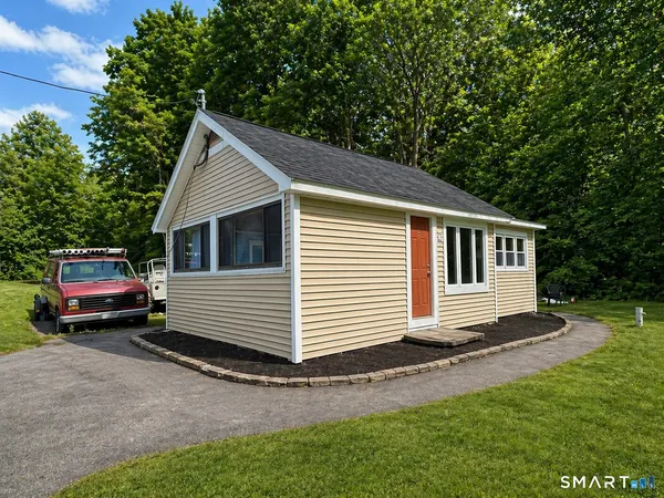 a front view of a house with a yard