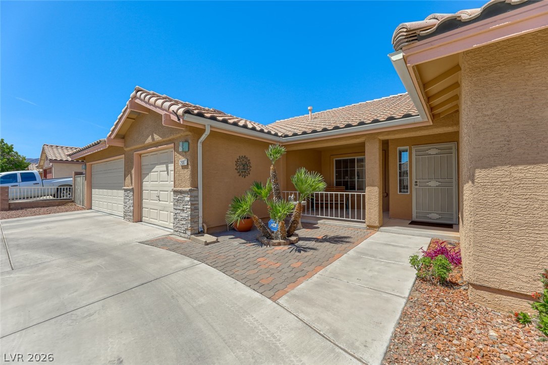 2001 Appaloosa Road Henderson, NV 89002 - Photo 43 of 44 The welcoming front entrance showcases a classic design with convenient garage access.