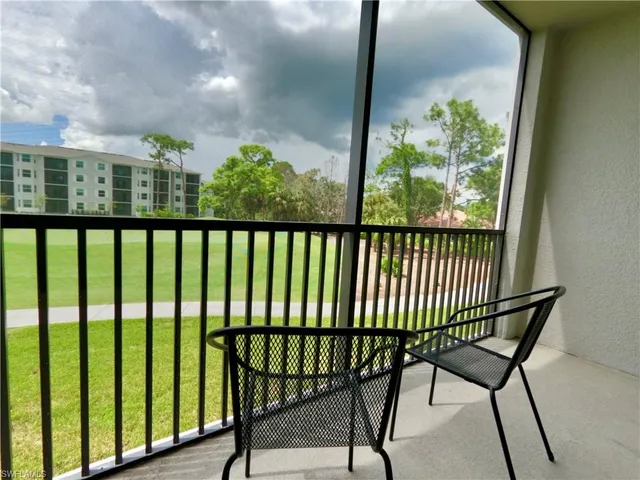 a view of a balcony with furniture