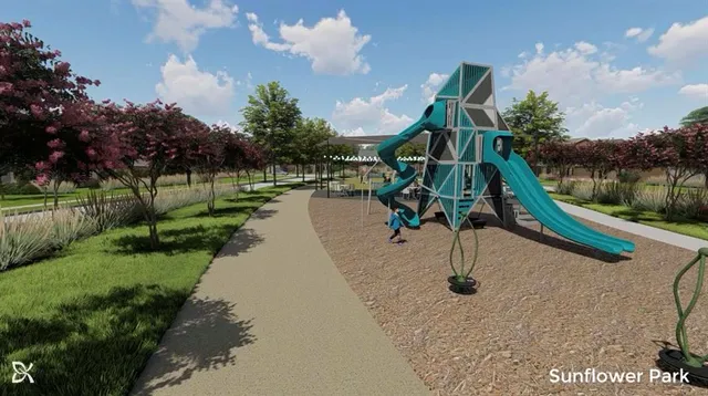 a park view with a slide and entertaining space