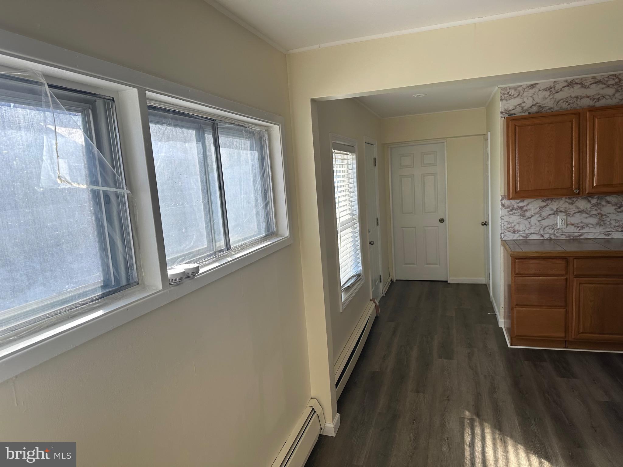 18 Victoria Lane Levittown, PA 19054 - Photo 15 of 19 a view of a livingroom with wooden floor and a fireplace