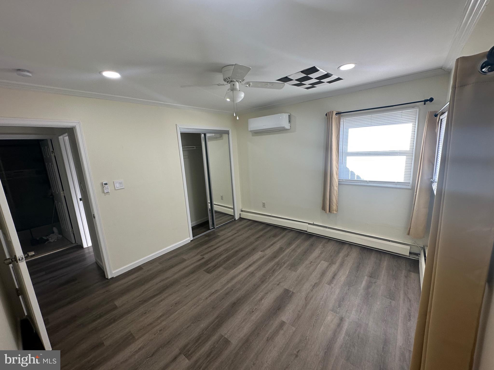 18 Victoria Lane Levittown, PA 19054 - Photo 6 of 19 wooden floor in an empty room with a window