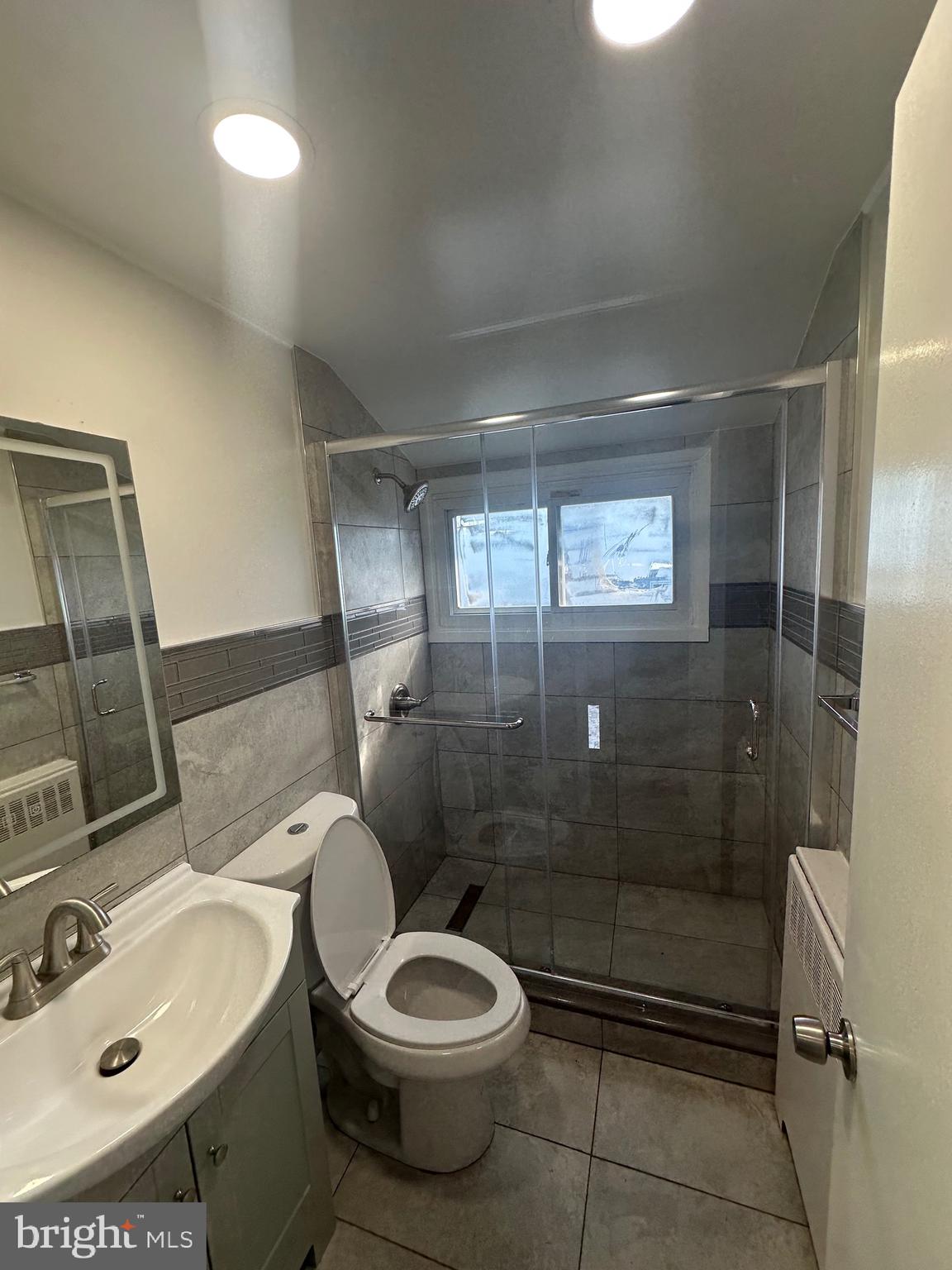 18 Victoria Lane Levittown, PA 19054 - Photo 8 of 19 a bathroom with a sink a toilet and shower