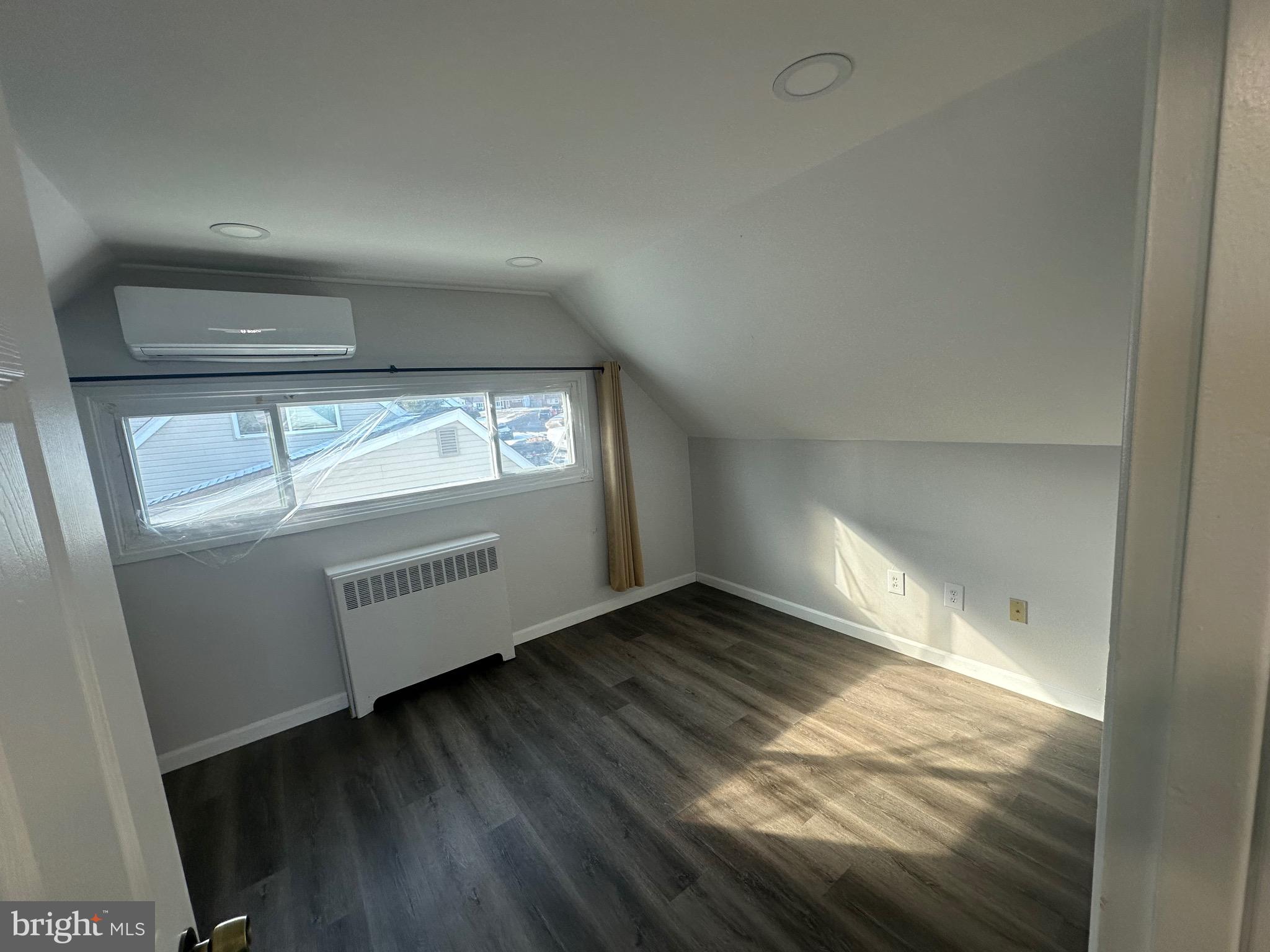 18 Victoria Lane Levittown, PA 19054 - Photo 10 of 19 an empty room with wooden floor and windows