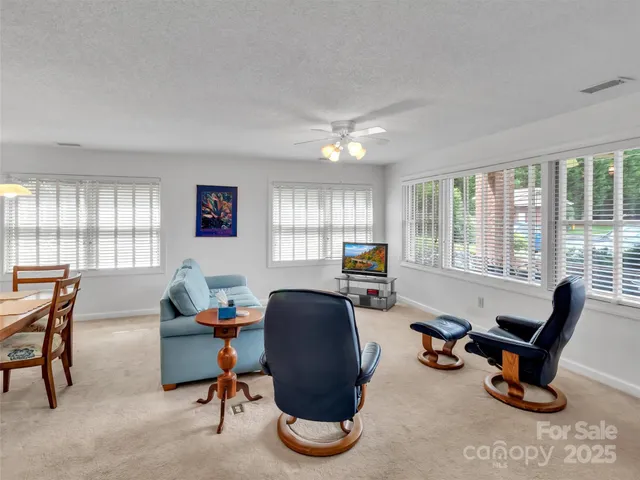 a dining room with furniture and window