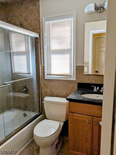 15 Friar Road Morris Plains, NJ 07950 - Photo 12 of 18 a bathroom with a granite countertop toilet a sink and a bathtub