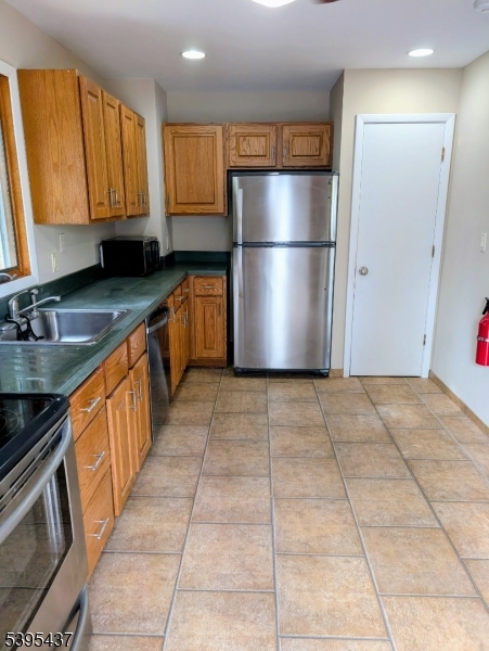 15 Friar Road Morris Plains, NJ 07950 - Photo 4 of 18 a kitchen with granite countertop a refrigerator a sink and dishwasher