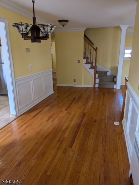 15 Friar Road Morris Plains, NJ 07950 - Photo 6 of 18 a view of a room with wooden floor and stairs