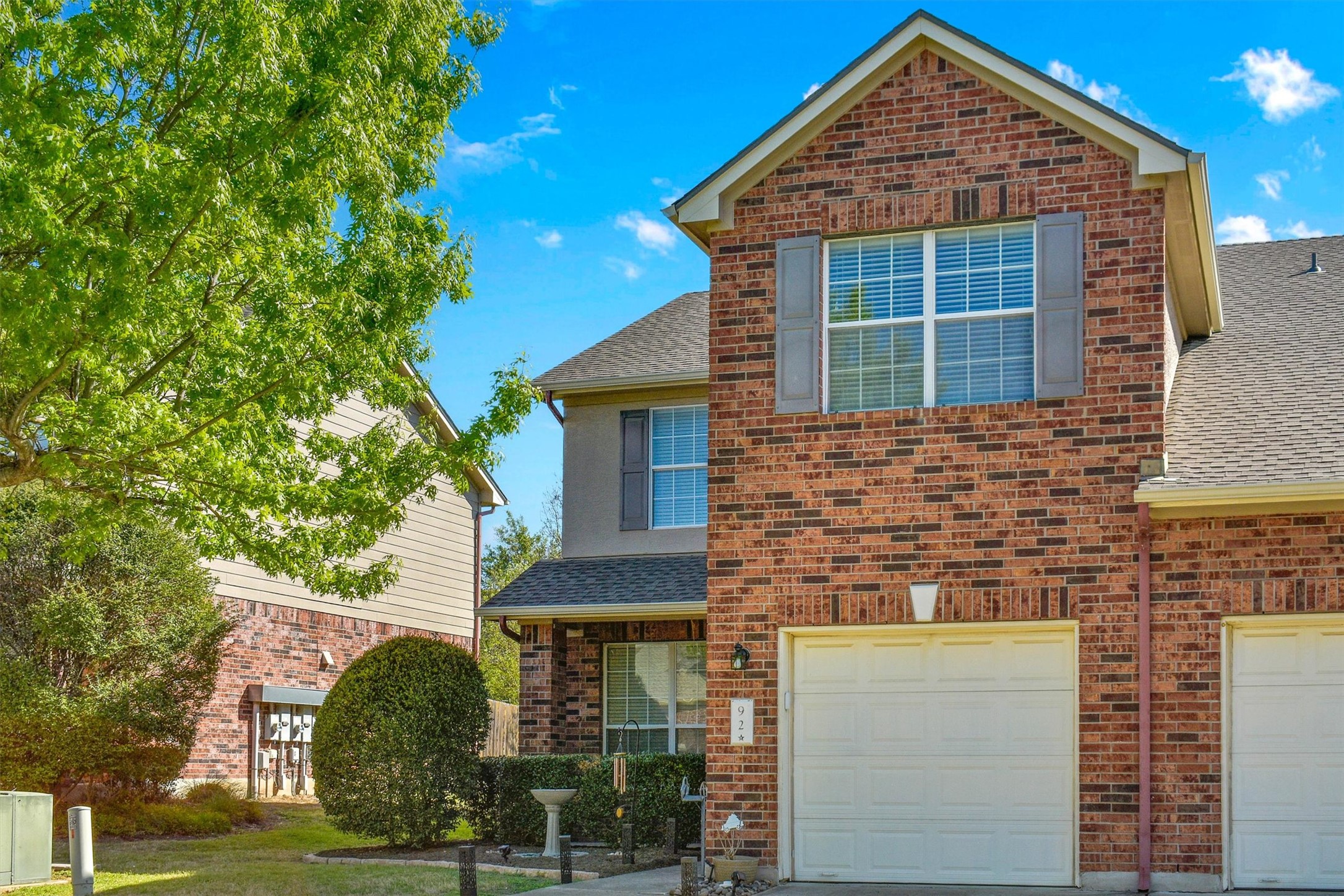 92 Verde Ranch Loop Leander, TX 78641 - Photo 2 of 37 a front view of a house with garden