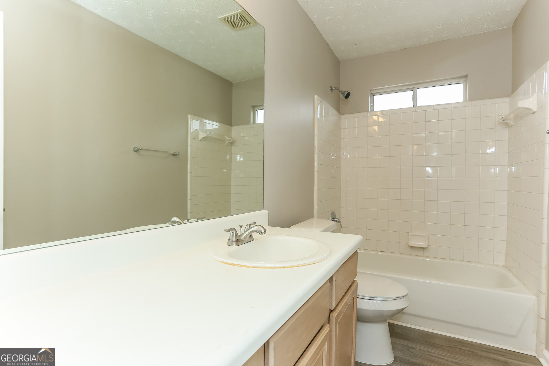 3797 Landgraf Cove Decatur, GA 30034 - Photo 13 of 17 a bathroom with a sink a toilet and shower