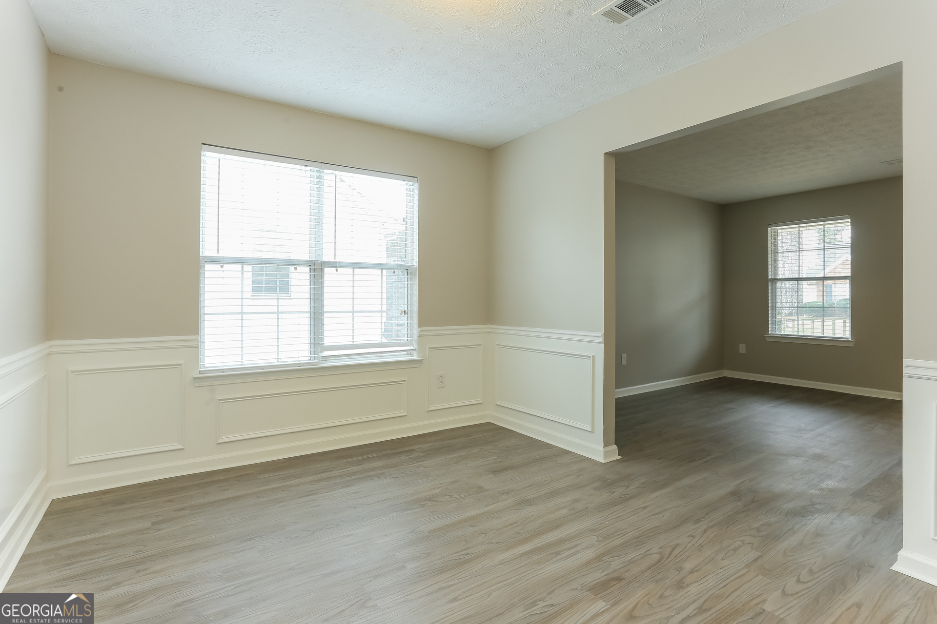 3797 Landgraf Cove Decatur, GA 30034 - Photo 3 of 17 an empty room with wooden floor and windows