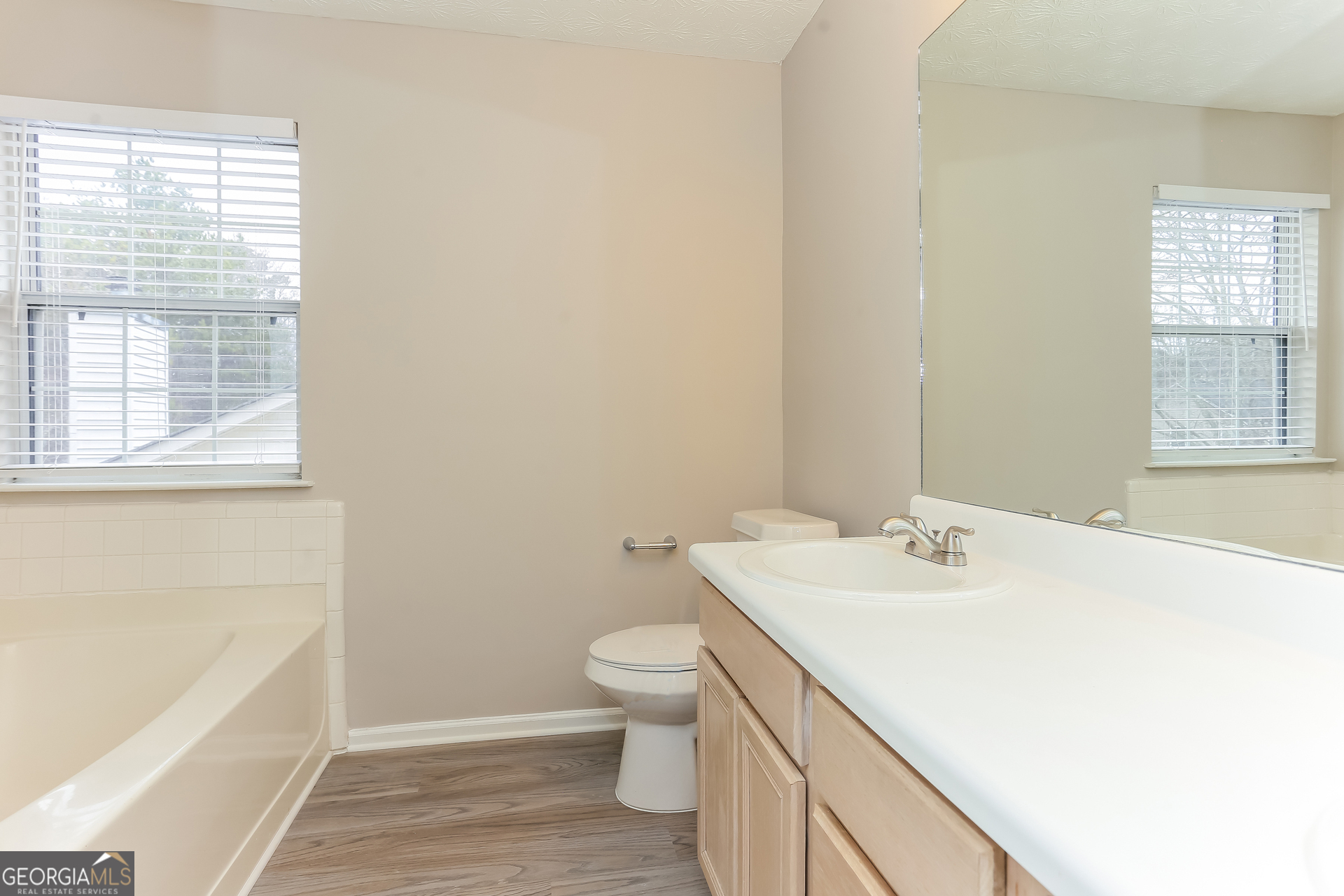 3797 Landgraf Cove Decatur, GA 30034 - Photo 10 of 17 a bathroom with a sink a toilet and tub