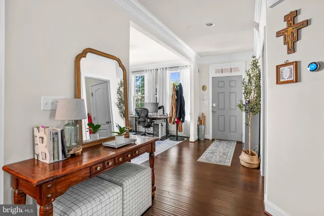 a living room with furniture and a mirror