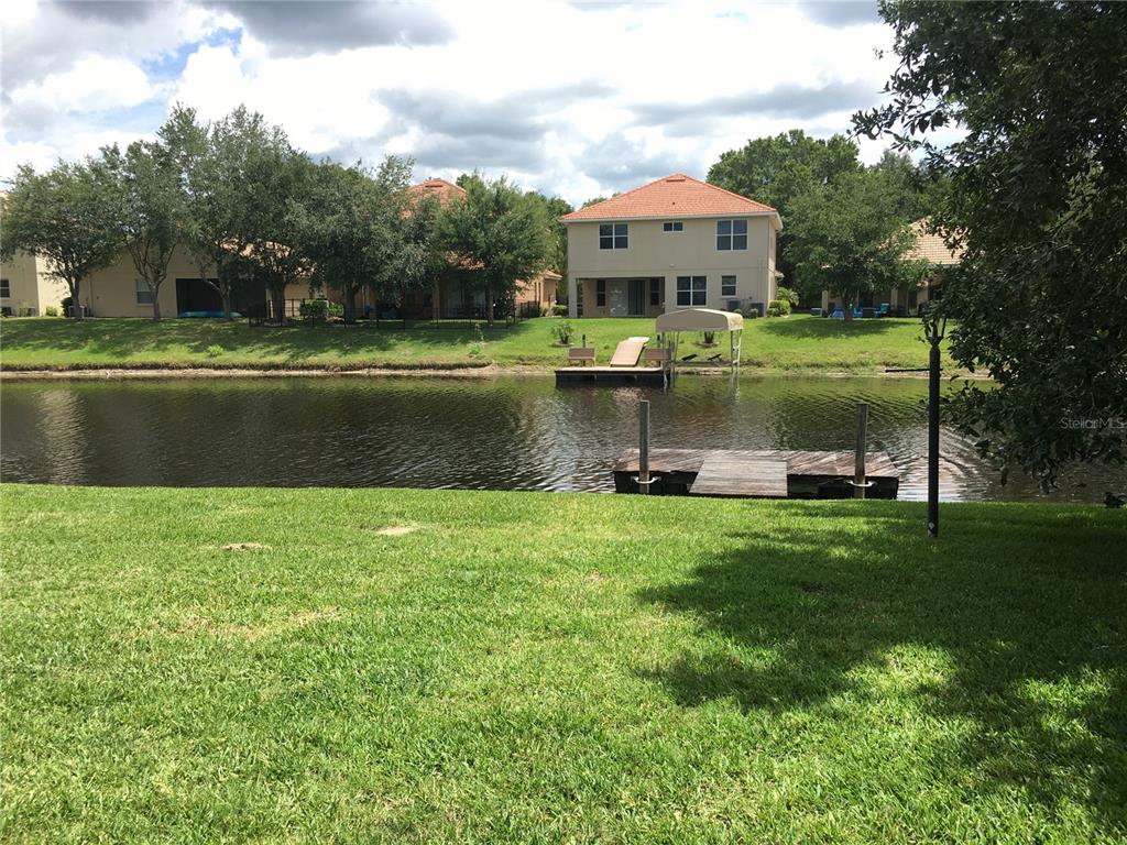 18047 Java Isle Drive Tampa, FL 33647 - Photo 2 of 21 a front view of a house with a lake view