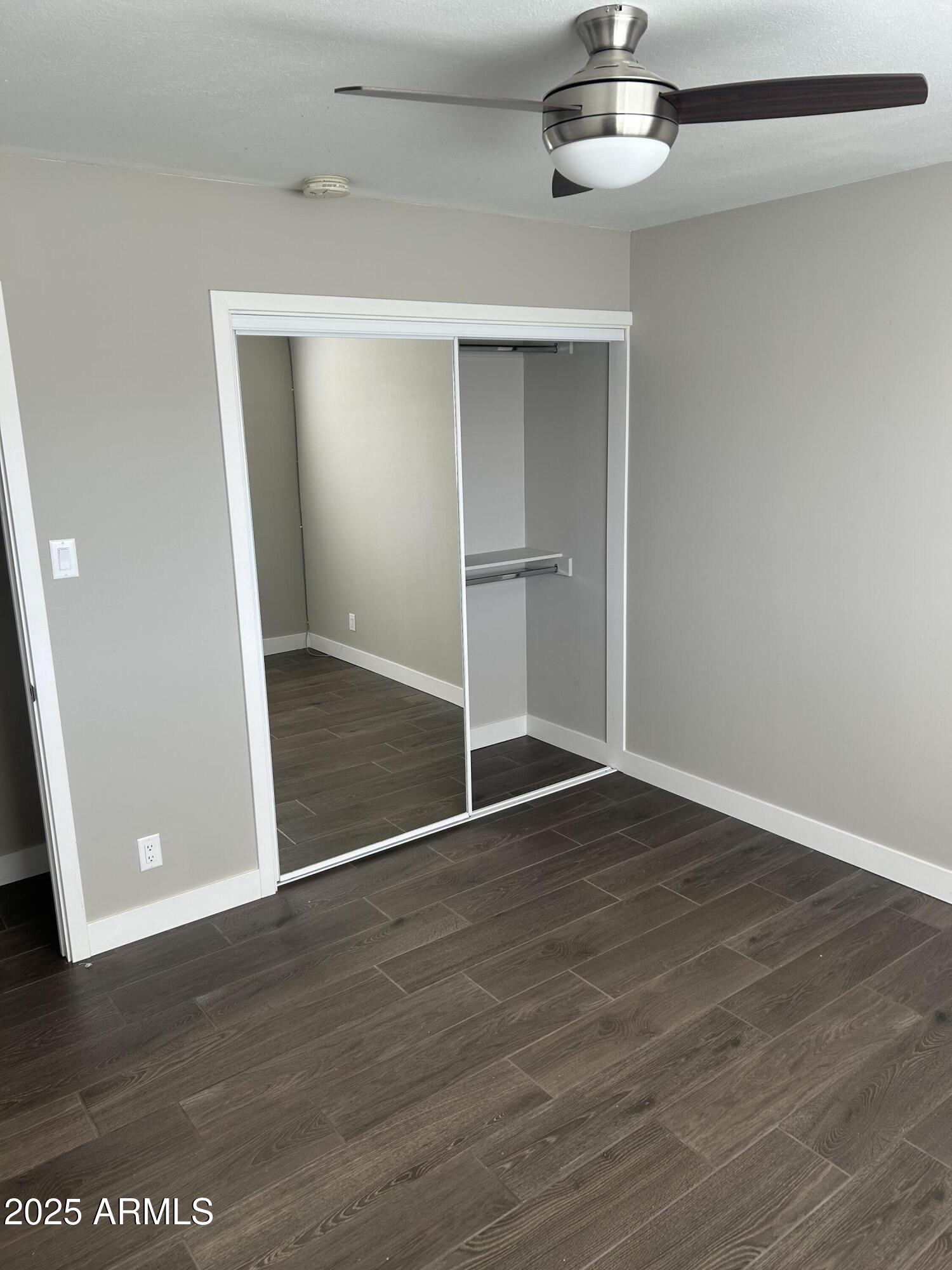 126 East Fillmore Street Tempe, AZ 85288 - Photo 11 of 20 a view of an empty room with wooden floor