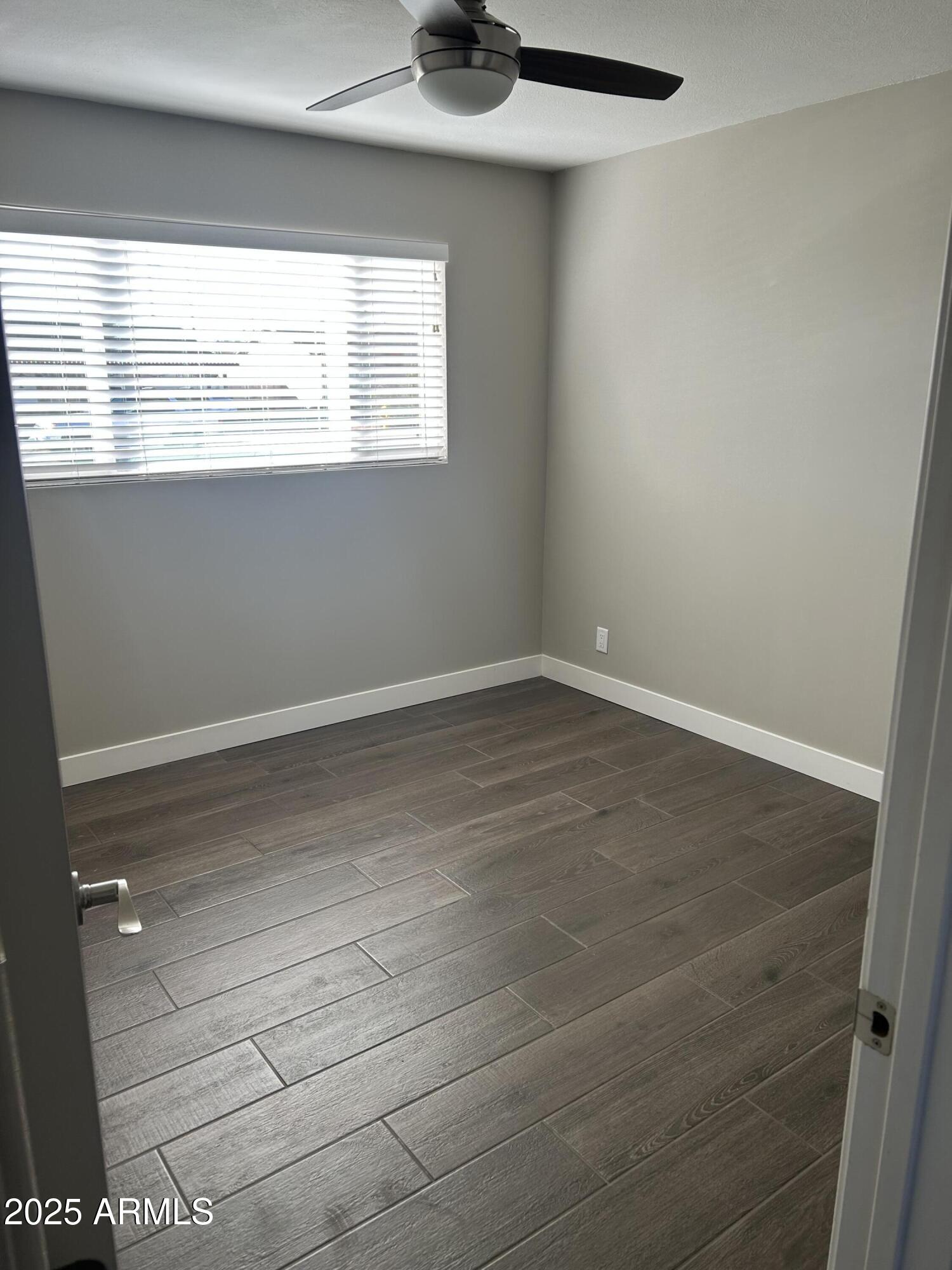 126 East Fillmore Street Tempe, AZ 85288 - Photo 12 of 20 a view of an empty room with a window