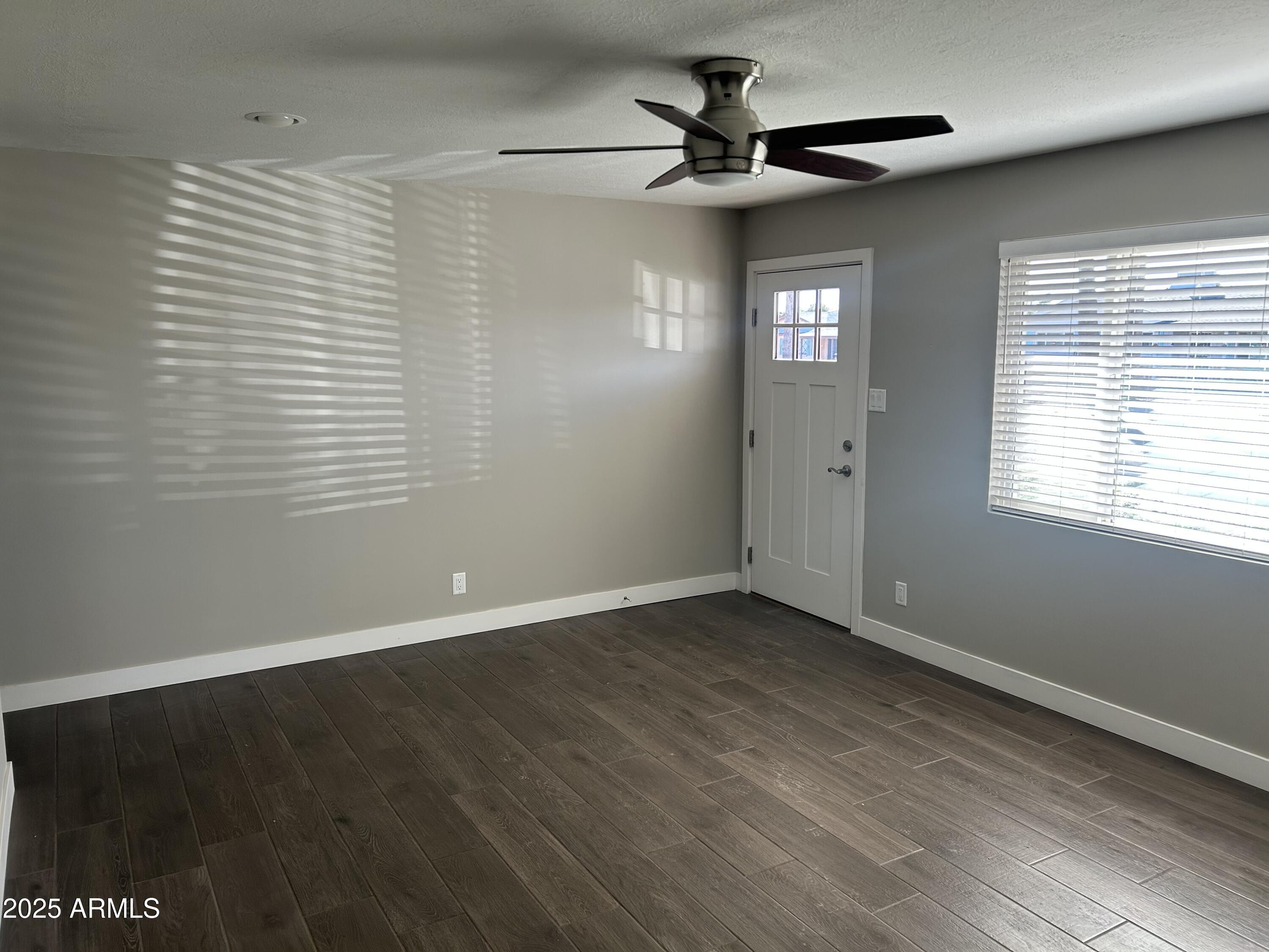 126 East Fillmore Street Tempe, AZ 85288 - Photo 3 of 20 a view of an empty room with a window