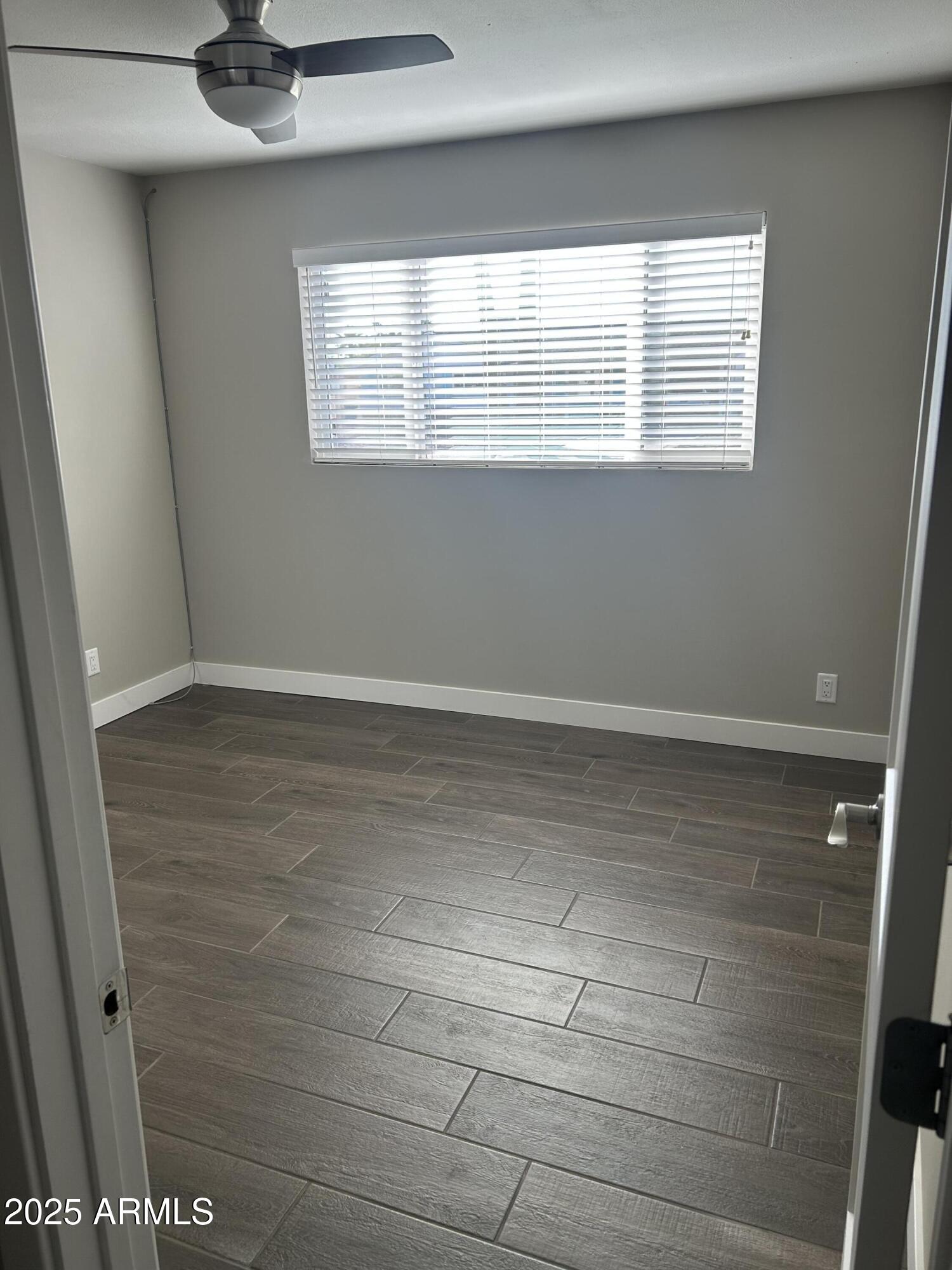 126 East Fillmore Street Tempe, AZ 85288 - Photo 10 of 20 a view of an empty room with a window