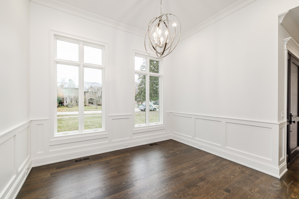 643 Abbotsford Road Kenilworth, IL 60043 - Photo 18 of 31 an empty room with wooden floor fan and windows