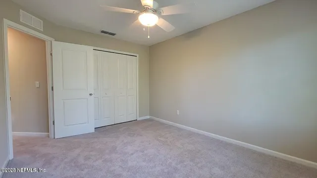 a view of a hallway with front door