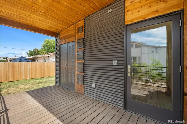 a view of a balcony with wooden floor