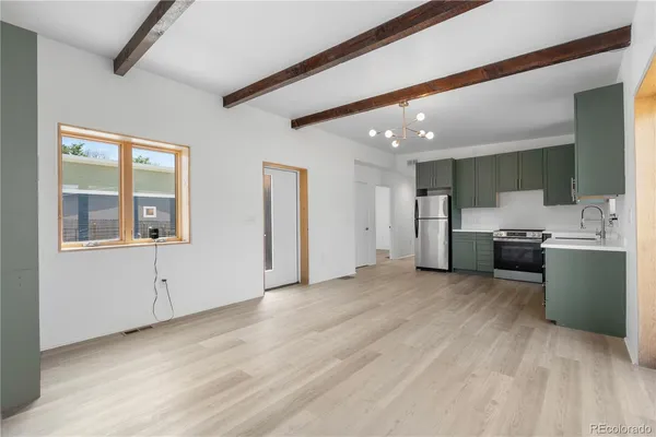 a view of a kitchen with a sink cabinets and window