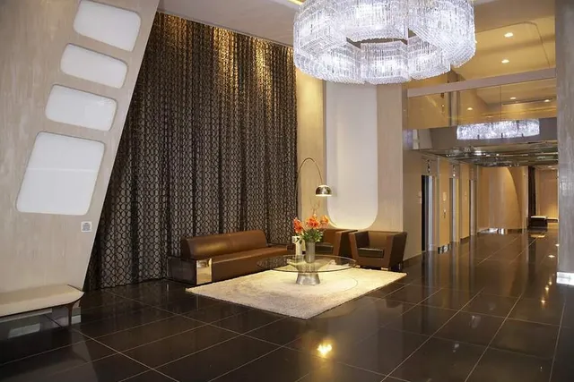 a bathroom with a mirror and a shower