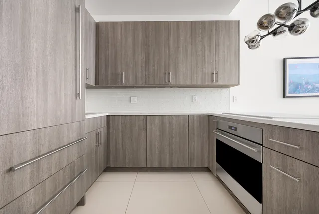 a open kitchen with stainless steel appliances granite countertop a stove and cabinets