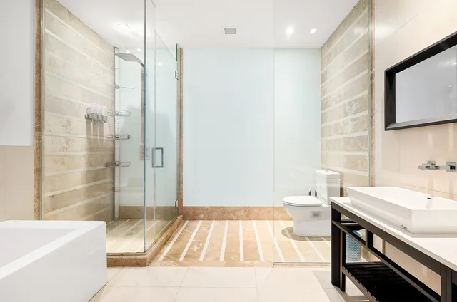 a spacious bedroom with a bed and a table