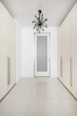 a view of a bathroom with a sink and mirror