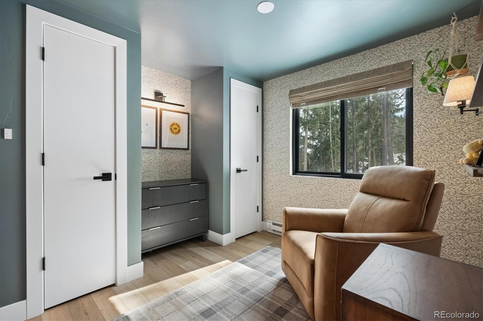 1633 Sinton Road Evergreen, CO 80439 - Photo 35 of 50 a living room with furniture and a gate