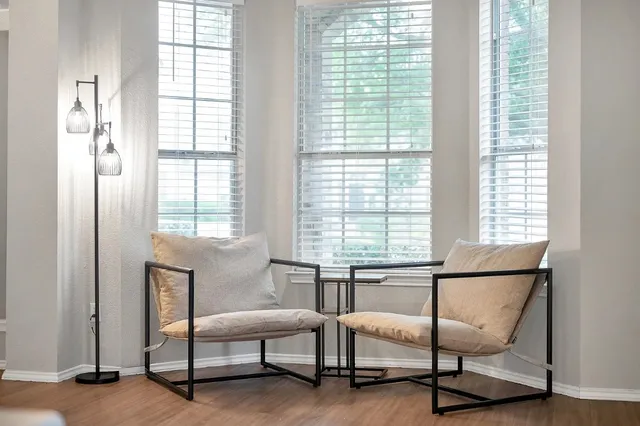 a bedroom with furniture and windows